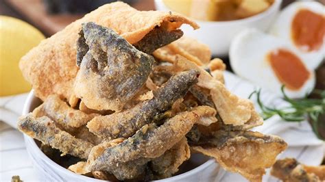  炸魚皮：カリカリの食感とジューシーな魚肉を同時に楽しめる Zhanjiang の名物！